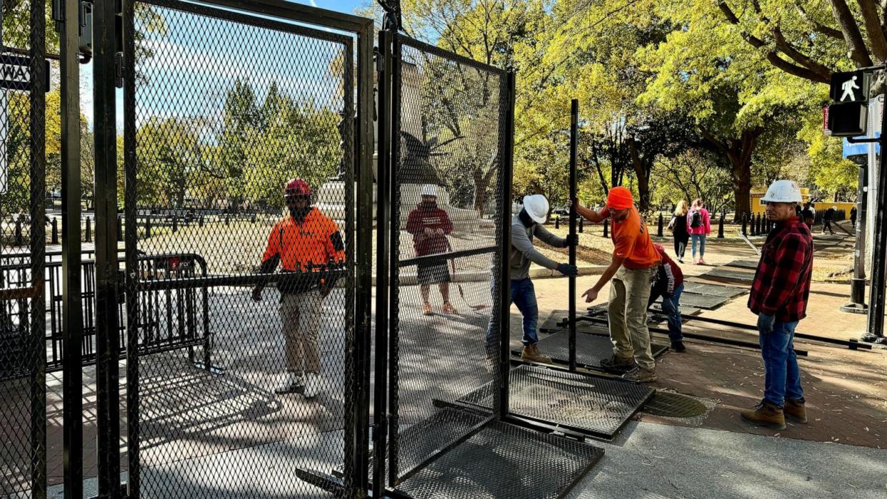 PHOTO: Security fencing is assembled around Lafayette Square as construction for the presidential inauguration parade takes place near the White House in Washington, Nov. 3, 2024.  (Daniel Slim/AFP via Getty Images)