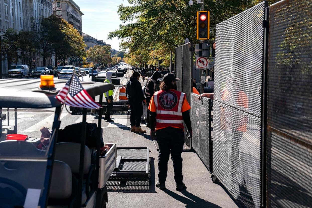 PHOTO: Workers erect anti-scale fencing around the White House and the Treasury Department , Nov. 3, 2024. The Nation's Capitol is bracing for protests and potential unrest with a contentious Election Day looming on the horizon.  (Kent Nishimura/Getty Images)