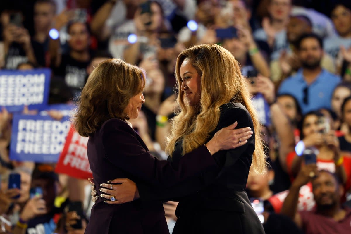 Beyonce with Harris at a campaign rally (AP)