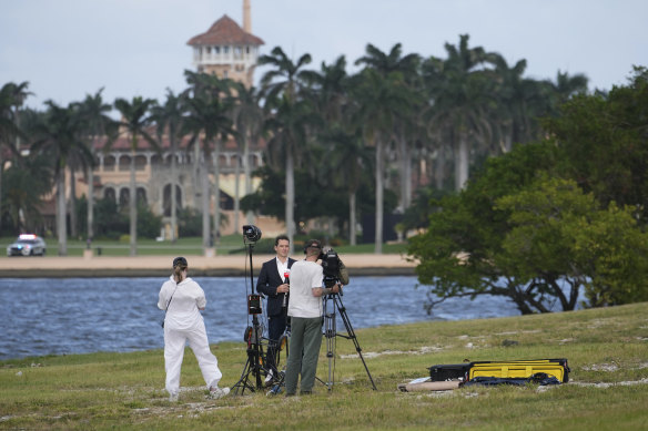 Sky News reporter Peter Stefanovic does a stand-up across from Trump’s Mar-a-Lago estate.