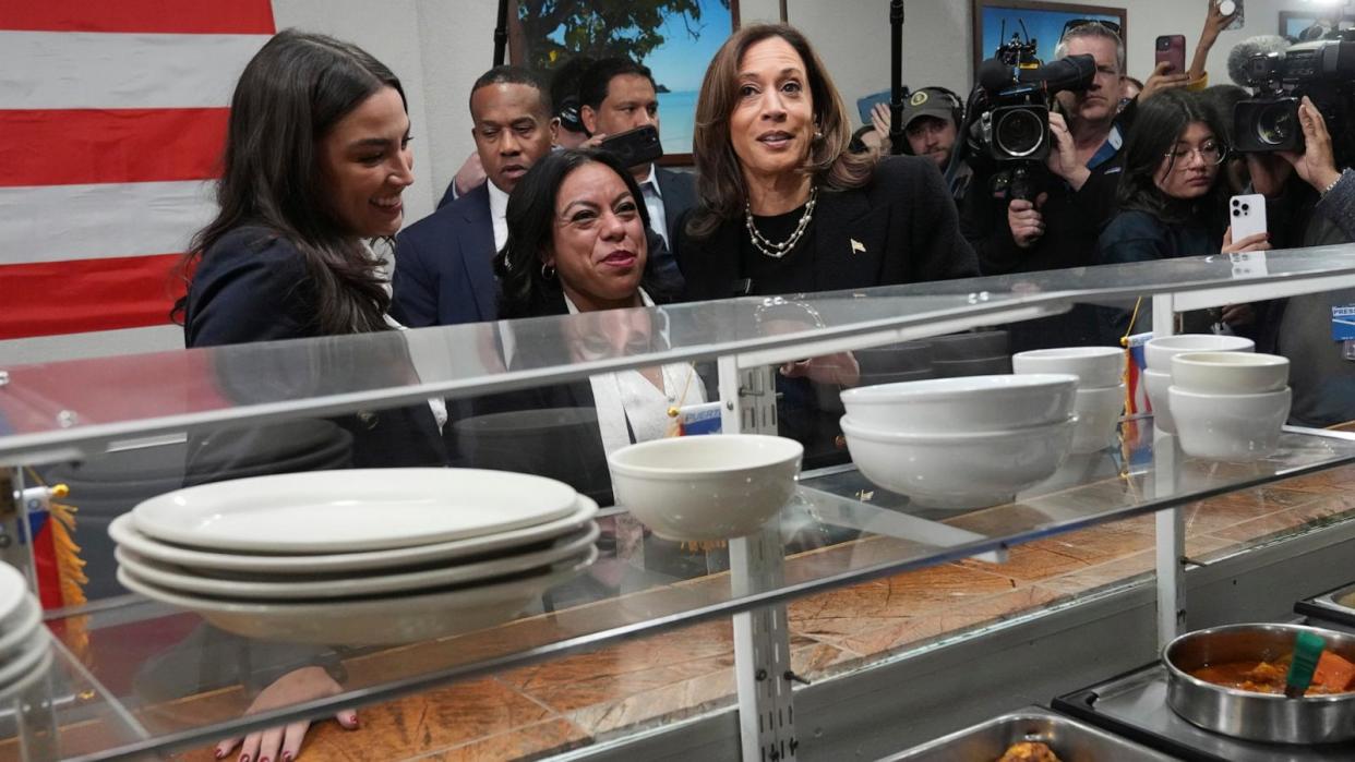 PHOTO: Democratic presidential nominee Vice President Kamala Harris visits Old San Juan Cafe restaurant with restaurant owner Diana de La Rosa and Rep. Alexandria Ocasio-Cortez, during a campaign stop in Reading, Pa., Nov. 4, 2024. (Jacquelyn Martin/AP)