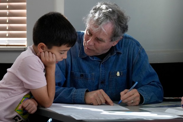 Sen. Sherrod Brown, D-Ohio, fills out his ballot with his...