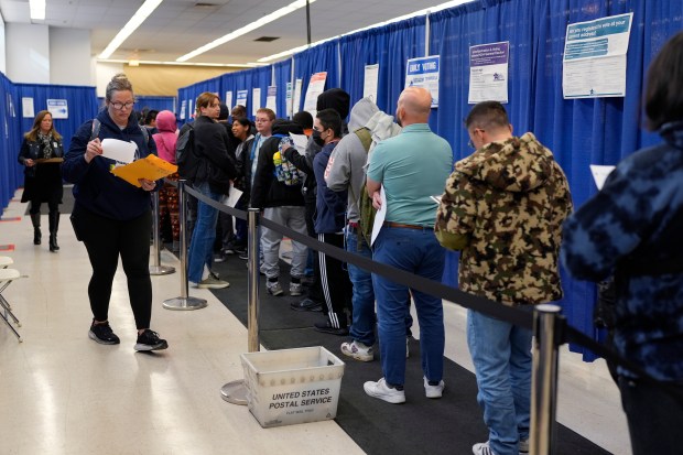 People line up to vote at the Chicago Early Voting Loop Supersite