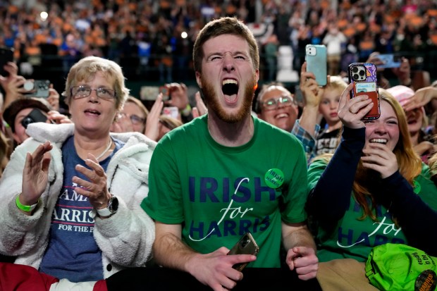 Supporters react as Democratic presidential nominee Vice President Kamala Harris speaks during a campaign rally