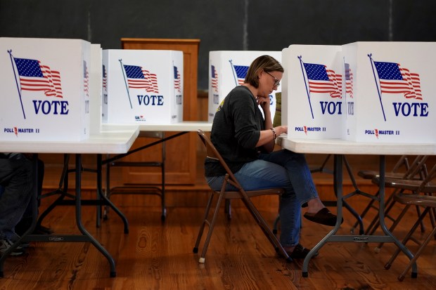 Kristin Scruggs votes at the 146-year-old Buck Creek school Tuesday,...