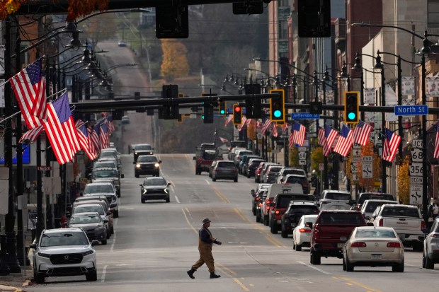 American flags line Main Street on Election Day, Tuesday, Nov....