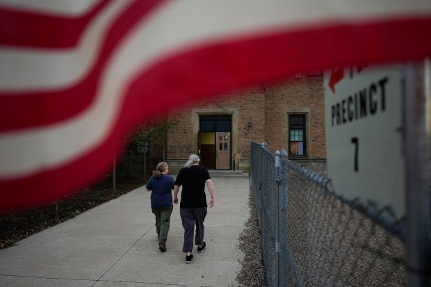 People arrive at a polling place, Tuesday, Nov. 5, 2024,...