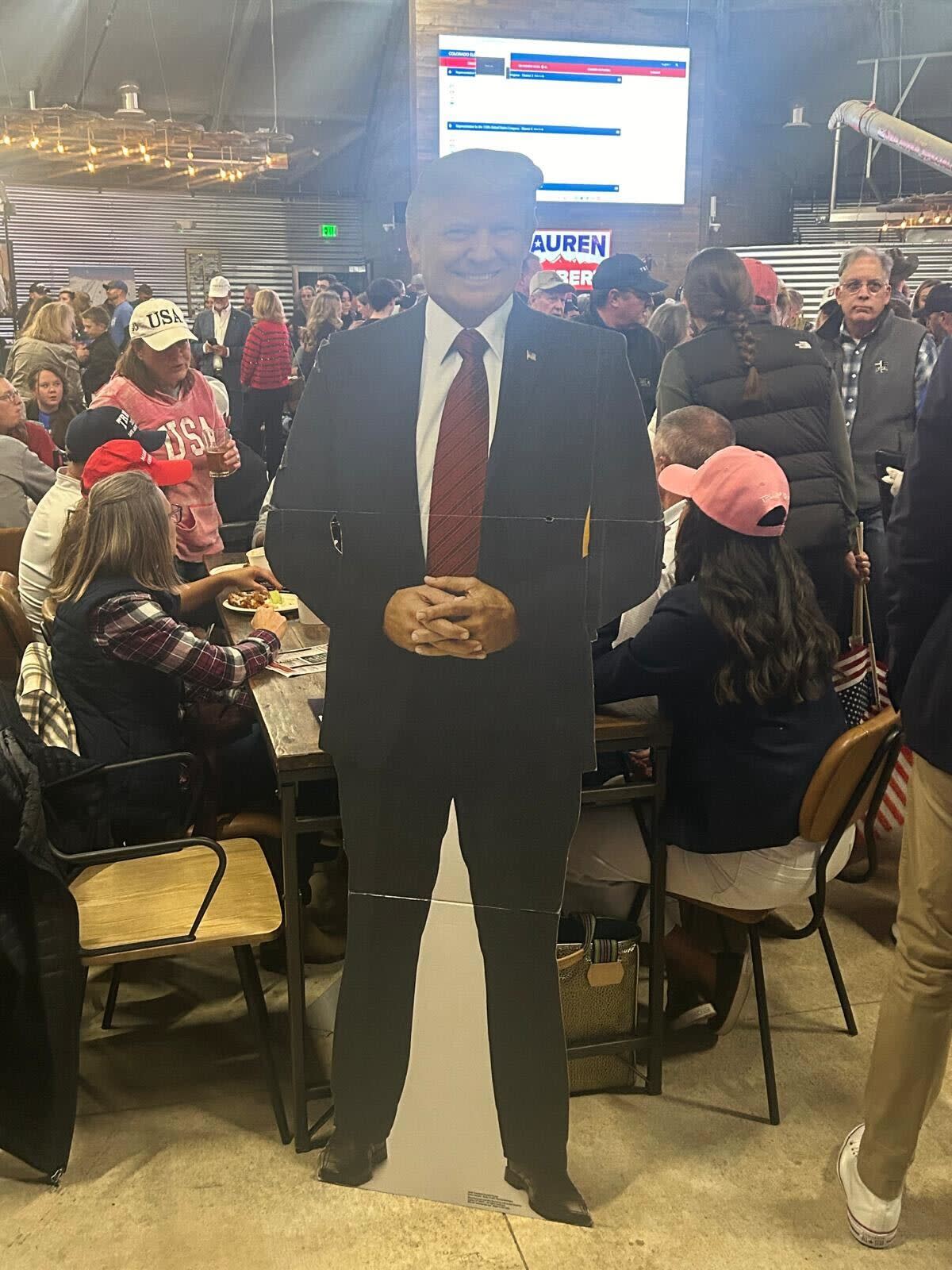 A Donald Trump cut out at the Boebert watch party (Sheila Flynn / The Independent)