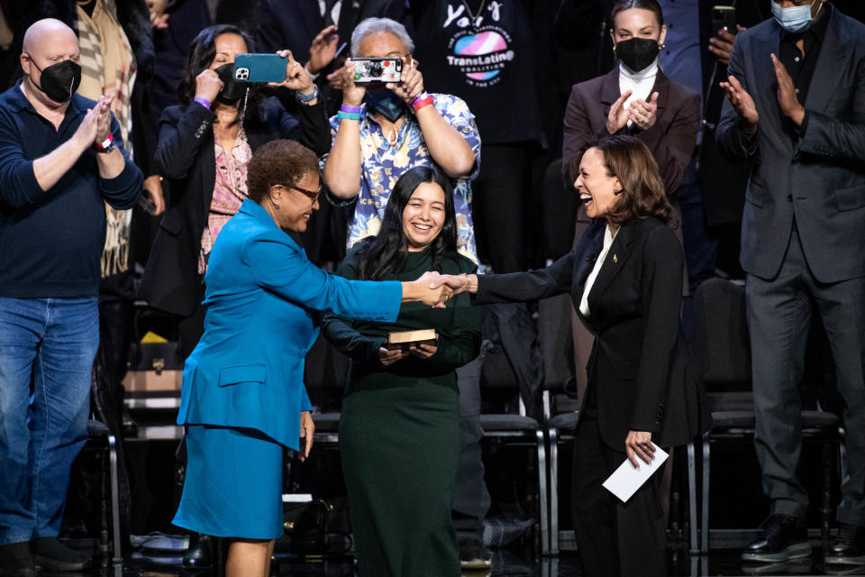 Karen Bass is sworn in as mayor of LA by Vice President Kamala Harris as her daughter Yvette Luchuga holds the Bible on Dec. 11, 2022