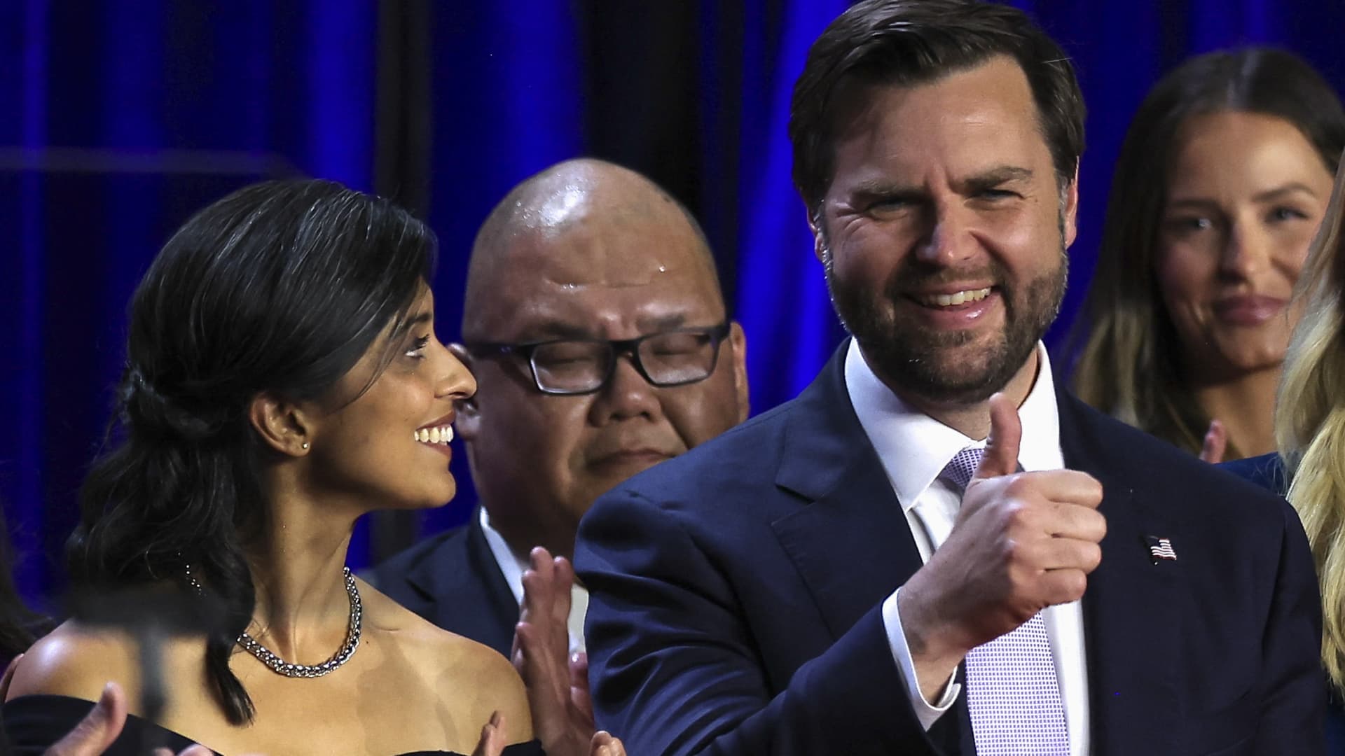 Republican vice presidential nominee JD Vance gestures next to his wife Usha Vance following early results from the 2024 U.S. presidential election in Palm Beach County Convention Center, in West Palm Beach, Florida, U.S., November 6, 2024. 