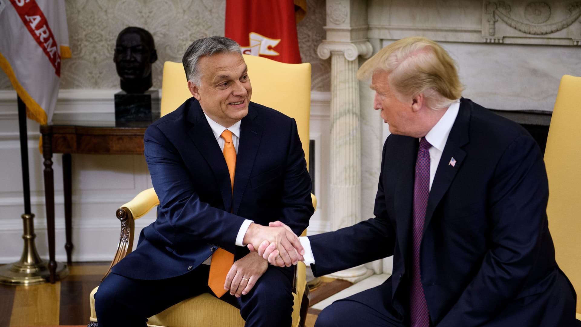 Hungary's Prime Minister Viktor Orban (L) and US President Donald Trump shake hands before a meeting in the Oval Office of the White House May 13, 2019, in Washington, DC.