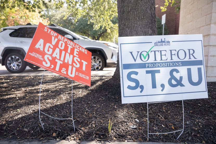 Signs for and against Propositions S, T, and U on display outside of the Oak Lawn Branch...