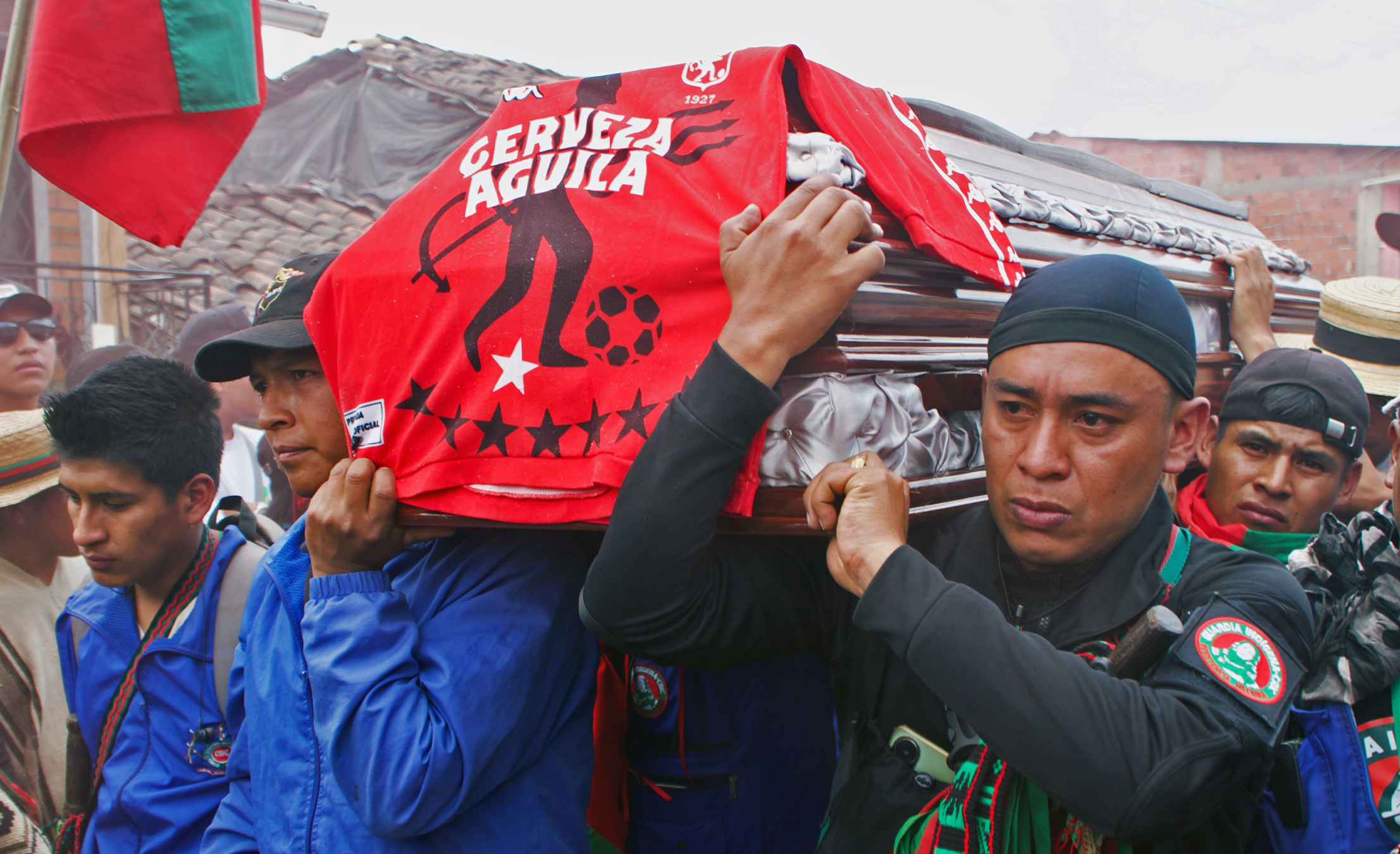 Carlos’ fellow guardians carry his coffin