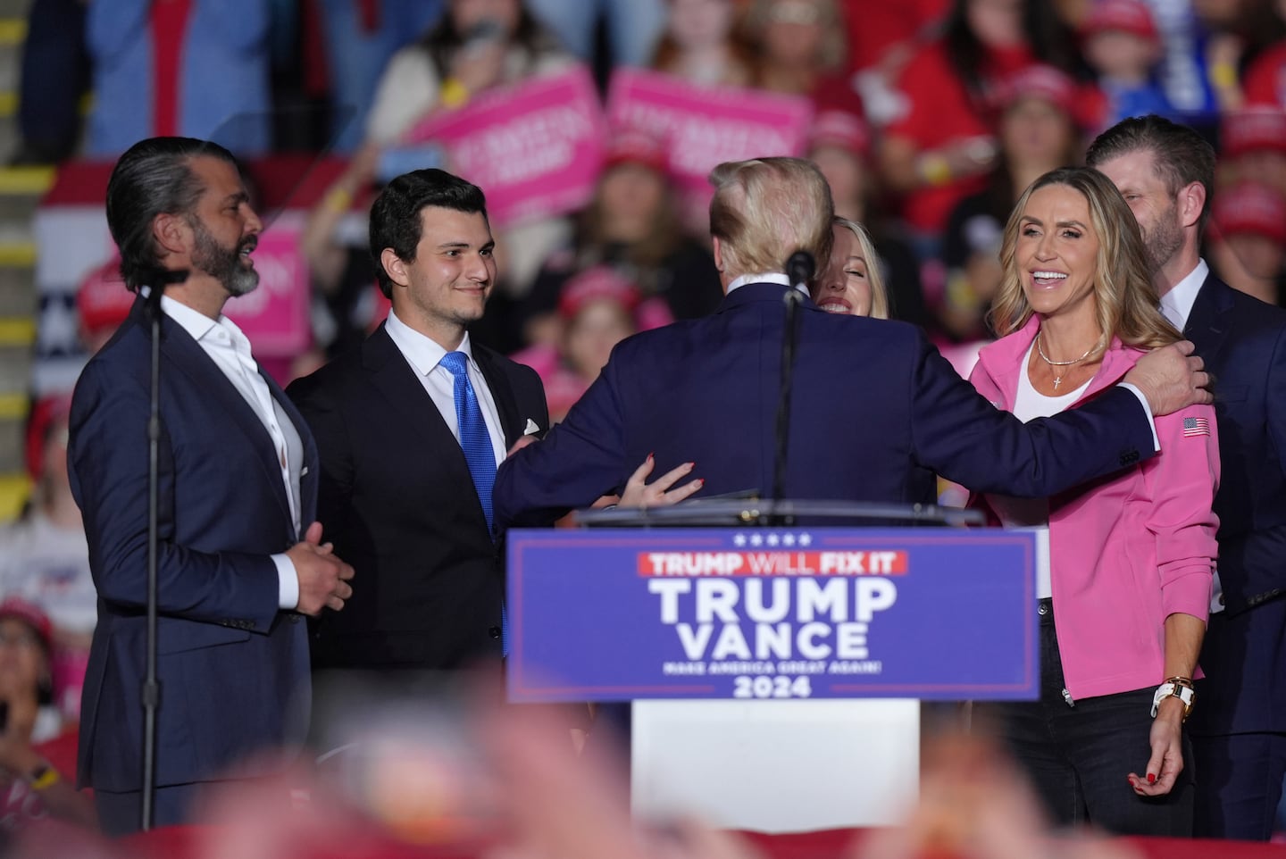 Republican presidential candidate former President Donald Trump, greets, from left, Donald Trump Jr., Michael Boulos, Tiffany Trump, Lara Trump and Eric Trump at a campaign rally, Monday, Nov. 4, 2024, in Reading, Pa. 