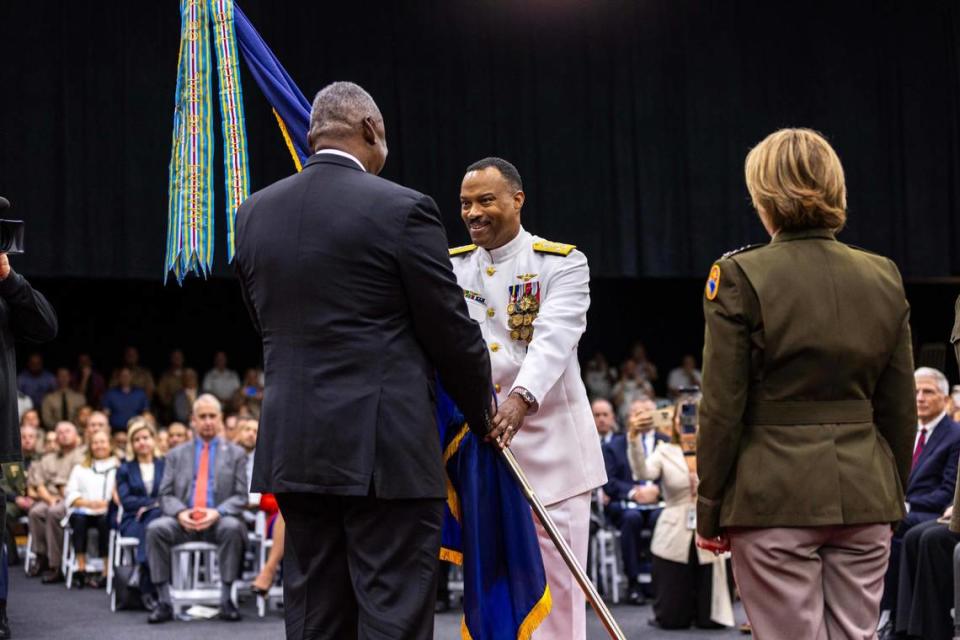 U.S. Navy Adm. Alvin Holsey receives the colors from U.S. Secretary of Defense Lloyd J. Austin III during the change of command ceremony at the U.S. Southern Command in Doral