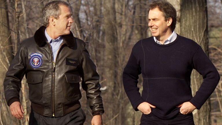 President George W. Bush and British Prime Minister Tony Blair walk together as they tour the grounds of Camp David February 23, 2001. The meeting is Bush's first with a European leader as he and Blair seek to reaffirm the special relationship which exists between the U.S. and Britain.
