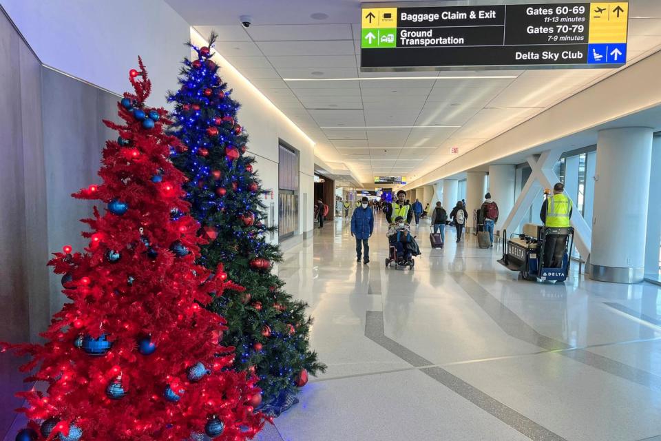 PHOTO: In this Nov. 22, 2022, file photo, passengers walk through the Delta terminal at LaGuardia Airport in Queens, New York. (Samuel Rigelhaupt/Sipa USA via AP, FILE)