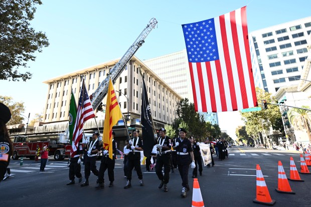 Members of the Vietnam Veterans of America march during the...