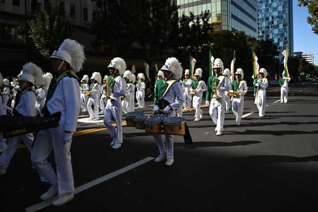 Mission San Jose High School marching band marches during the...