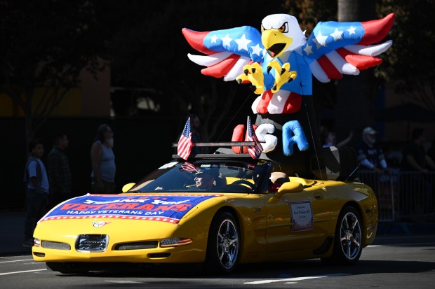 Colonel Dean Winslow, MD, rides in his Corvette during the...