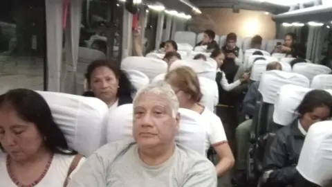 Peru Tourism Ministry People sit on a bus