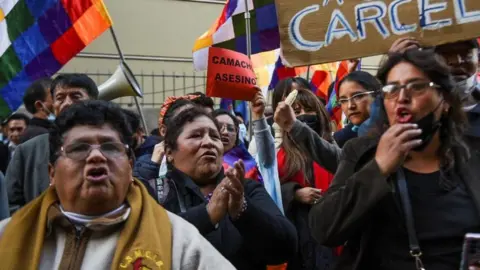 Reuters People gather to support the detention of Luis Fernando Camacho, the governor of Santa Cruz and a prominent opposition leader, by Bolivia's police outside Bolivia's attorney general in La Paz