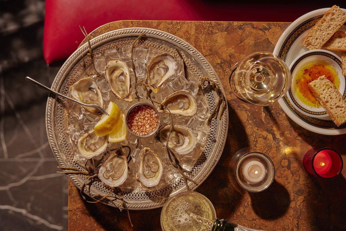 A plate of raw oysters and serving of rye focaccia at Fet-Fisk.  