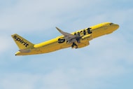 A Spirit Airlines airplane takes flight from Dallas-Fort Worth International Airport in...