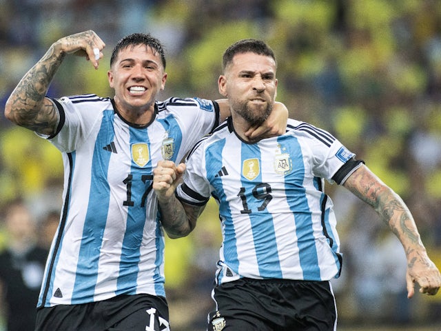 Argentina's Enzo Fernandez and Nicolas Otamendi celebrate their goal on November 21, 2023