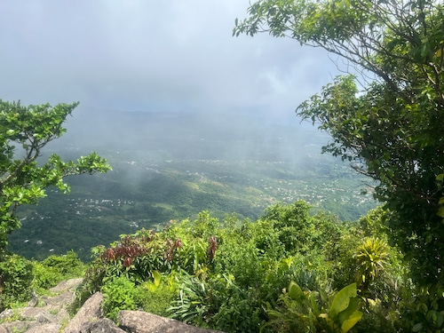 A view of St. Lucia from the peak of Gros Piton, as clouds roll in from an incoming storm.