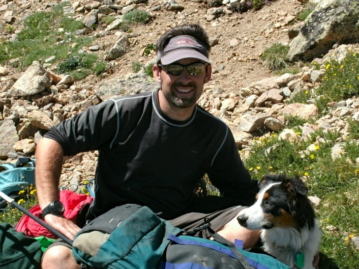 Author James Dziezynski and border collie Fremont on Mount Elbert