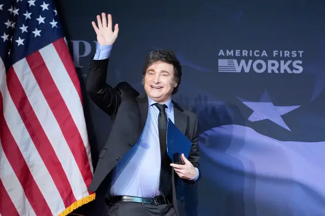 Argentina's President Javier Milei arrives to speak before President-elect Donald Trump during an America First Policy Institute gala at his Mar-a-Lago estate