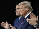 Former U.S. President and 2024 Republican presidential candidate Donald Trump, alongside Senator Marco Rubio of Florida, applauds during the third day of the 2024 Republican National Convention at the Fiserv Forum in Milwaukee, Wisconsin, on July 17, 2024.