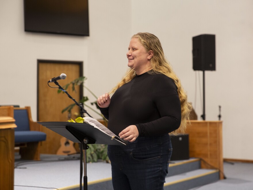 Music director Stephanie Helleckson, who has spent most of her life in Paonia, leads community choir practice at the church.