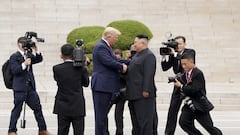 FILE PHOTO: U.S. President Donald Trump meets with North Korean leader Kim Jong Un at the demilitarized zone separating the two Koreas, in Panmunjom, South Korea, June 30, 2019. REUTERS/Kevin Lamarque/File Photo/File Photo