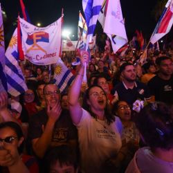 Supporters of Uruguay's presidential candidate for the Frente Amplio coalition, Yamandú Orsi, attend his campaign closing rally in Las Piedras, Canelones Department, Uruguay, on November 20, 2024. 