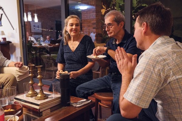 Enoch Rinks, right, speaks with Pochi and Pedro Vera during a birthday party at the home of Ike and Nora Yegros. “Pedro is originally from Chiloe, Chile. Pochi is from Pilar, Paraguay,” Rinks said. “They have been leaders in the church in Asunción for years.”