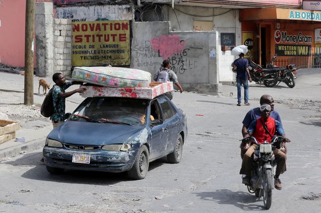 Masses flee homes and neighbourhoods in Haiti as gangs make violent push for power during political turmoil