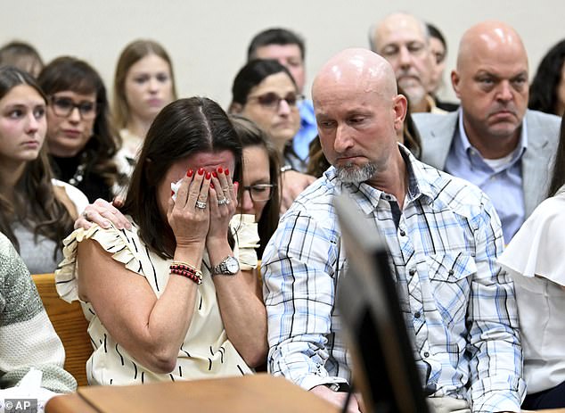 Allyson Phillips, second from left, mother of Laken Riley, breaks down in tears as the trial of Jose Ibarra kicks off at Athens-Clarke County Superior Court on Friday. Her husband John Phillips is seen comforting her