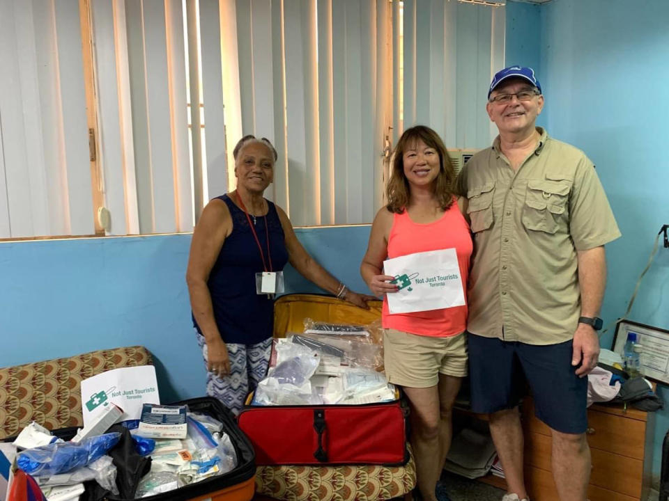 A vacationing couple brings a suitcase of medical supplies to a drop-off location in Cuba. (Not Just Tourists)