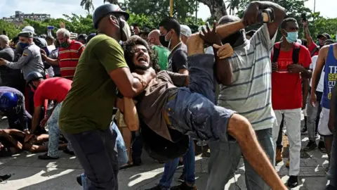 Getty Images A man is arrested in Cuba