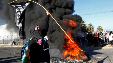 Reuters People take part in a protest against Chiles government