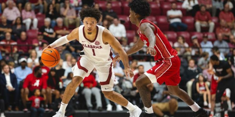 Nov 8, 2024; Tuscaloosa, Alabama, USA; Alabama Crimson Tide guard Mark Sears (1) drives the ball against Arkansas State Red Wolves guard Terrance Ford Jr. (11) during the second half at Coleman Coliseum. Mandatory Credit: Will McLelland-Imagn Images