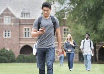 A student texts on a cellphone in this stock photo. (Ariel Skelley/Getty Images)
