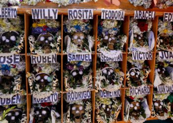Bolivians carry adorned human skulls asking for favors in the Ñatitas festival in La Paz