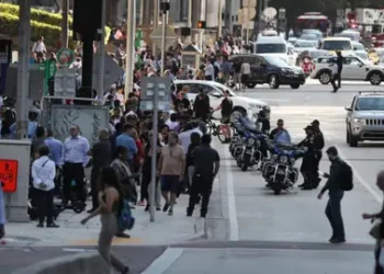 Getty Images People wait outside after evacuating office buildings in Miami, Florida after an earthquake struck in the Caribbean