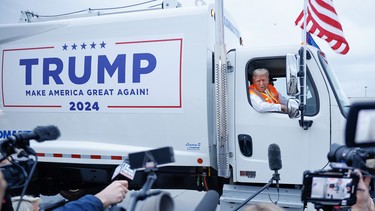 Republican presidential nominee, former President Donald Trump holds a press conference from inside a trash hauler at Green Bay Austin Straubel International Airport on October 30, 2024 in Green Bay, Wisconsin