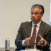 A photo of Rob Bonta gesturing with his hands during an interview.