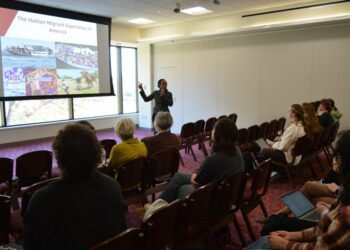 Springfield College Vice President for Campus Life and Inclusion Slandie Dieujuste presents the hate Haitians receive in America