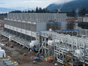 Cooling towers used to dissipate heat generated when natural gas is converted into liquefied natural gas are seen under construction at the LNG Canada export terminal, in Kitimat, B.C., in late 2022.